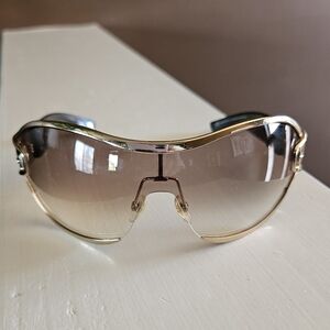 Gucci Gold Sunglasses With Buckles Sides.